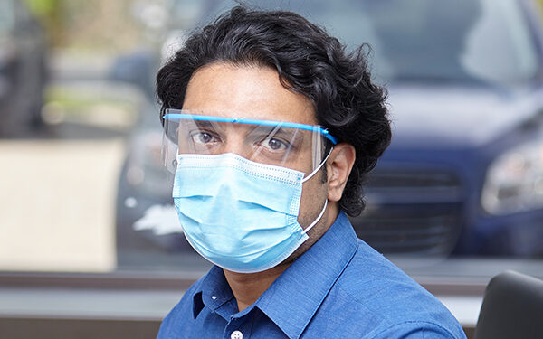 Man Wearing Face Shield and Mask