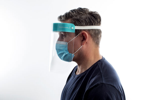 Man Wearing Face Shield and Mask from side profile.